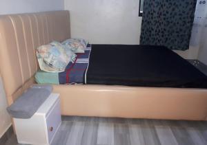 En eller flere senge i et værelse på Nyamata City View Apartments