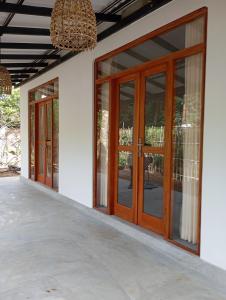 a pair of pivot doors on a house at Emerald retreat in Ahangama