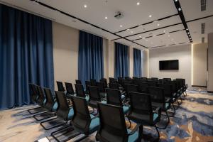 a conference room with chairs and a screen at Qashqadaryo Hotel Olympic Village in Tashkent +110 photos