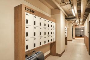 a hallway of an office with a row of lockers at Monrêve Cabins 몽헤브캐빈즈 in Seoul
