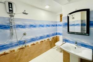 a bathroom with a shower and a toilet and a sink at D n A secret Palace in Tangalle