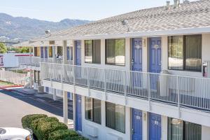 a building with blue doors and windows at Motel 6-Ukiah, CA in Ukiah
