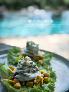 a plate with some food on top of lettuce at Villa Hillcrest Weligama in Weligama +157 photos