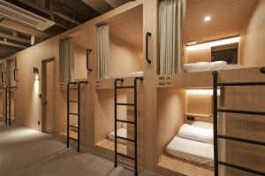 a group of bunk beds in a room at Monrêve Cabins 몽헤브캐빈즈 in Seoul +19 photos