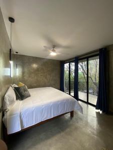 En eller flere senge i et værelse på Hotel Casa Grangelo