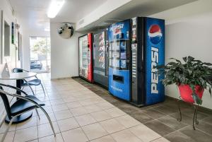 a room with two large soda machines on the wall at Motel 6-Lenexa, KS - Kansas City Southwest in Lenexa