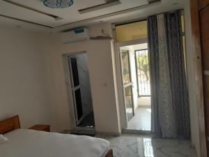 Giường trong phòng chung tại Port View Luxury Apartment Escacle Ziguinchor