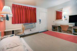 a hotel room with a bed and a desk and a window at Motel 6-Chino, CA - Los Angeles Area in Chino