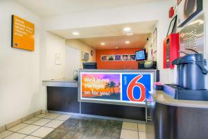 a fast food restaurant with a sign on the counter at Motel 6-Chino, CA - Los Angeles Area in Chino