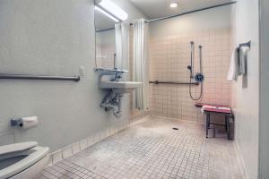 a bathroom with a sink and a shower and a toilet at Motel 6-Chino, CA - Los Angeles Area in Chino