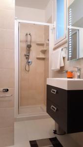 a bathroom with a shower and a sink at NoMapartments Il Cortile Romey in Trapani