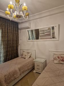 Postel nebo postele na pokoji v ubytování Résidence Tunis Carthage