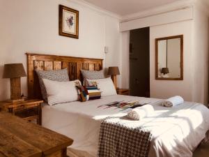 En eller flere senge i et værelse på MELJAA GROUP Guesthouse