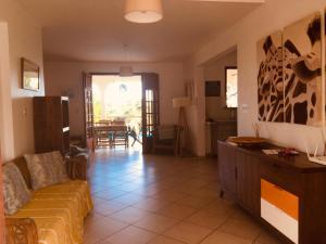 a living room with a couch and a table at Villa Ticitron in Sainte-Anne