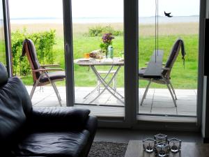 a view of a patio with a table and chairs at Deichhaus Boddentraum in Breege
