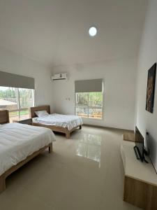 Postel nebo postele na pokoji v ubytování Salalah Social Club + 58 fotografií