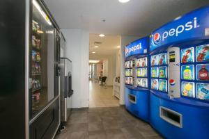 a aisle of a grocery store with a vending machine at Motel 6-Brooklyn Center, MN - Minneapolis in Brooklyn Center