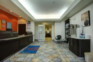 a lobby of a fast food restaurant with a hallway at Motel 6-Denison, TX in Denison