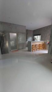 a living room with a table and chairs in it at Pool Villa Rai View Khao in Ban Klang +6 photos
