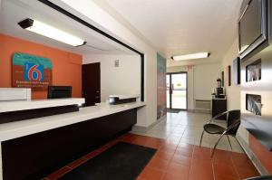 a waiting room with a chair in a building at Motel 6-South Haven, KS in South Haven +16 photos