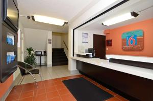 a lobby of an office with a waiting room at Motel 6-South Haven, KS in South Haven