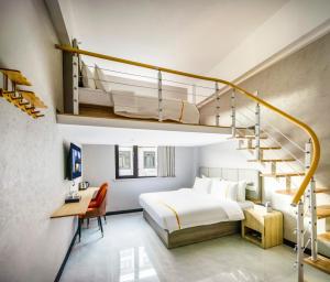 a bedroom with a large bed and a staircase at Shanghai Rui deng hao Hotel-Free shuttle bus to Airport and Disneyland 24x7 in Shanghai +66 photos