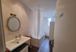 a bathroom with a sink and a mirror on the wall at Süße Marie 2 in Karlsruhe