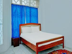 Postel nebo postele na pokoji v ubytování Hotel O Kost Axcel