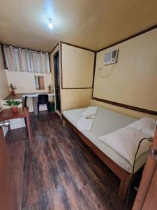 En eller flere senge i et værelse på Blessed Villa El Nido