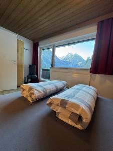 En eller flere senge i et værelse på Haus Herma