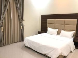 Postel nebo postele na pokoji v ubytování الذيابي للشقق المخدومة