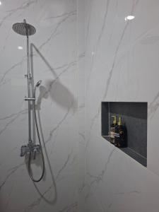 a shower in a bathroom with a glass wall at Juma cottages in Tuktuk Siadong +155 photos