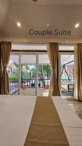 En eller flere senge i et værelse på SANTINIKETAN RETREAT, Bolpur