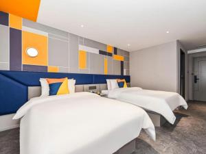 Postel nebo postele na pokoji v ubytování 7 Days Inn Nanjing Xinjiekou Changfu Street Metro Station + 245 fotografií