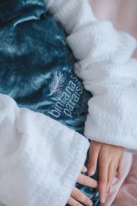 a person is holding a green stuffed animal at Bintana Sa Paraiso in Mambajao +254 photos