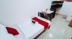 Kuchyň nebo kuchyňský kout v ubytování RedDoorz near SGM Condotel Villa Beach Iloilo