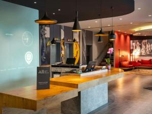 a lobby with a desk with a laptop on it at Ibis Istanbul Zeytinburnu in Istanbul
