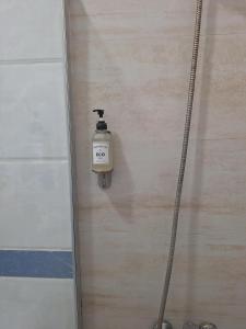 a soap dispenser on the side of a wall at The Archipelago Waterfront in Zanzibar City +48 photos