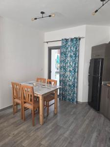 a dining room with a wooden table and chairs at 2 Bedroom Duplex - Hurghada in Hurghada
