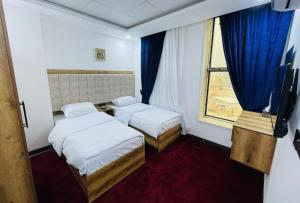 Postel nebo postele na pokoji v ubytování هوتيل وموتيل دانزه + 21 fotografií