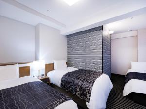 En eller flere senge i et værelse på APA Hotel Osaka Tanimachi 4chome Ekimae Kita + 29 billeder