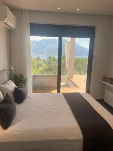 En eller flere senge i et værelse på Villa Asteria - Modern Ionian Villa