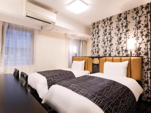 En eller flere senge i et værelse på APA Hotel Osaka Tanimachi 4chome Ekimae Kita
