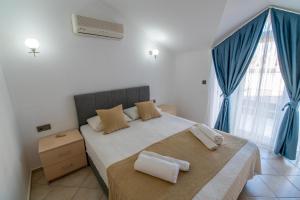 Postel nebo postele na pokoji v ubytování Sunset Beach Club Aqualettings Neptune 6