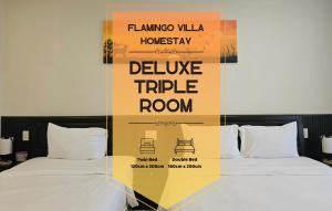 due letti con un cartello che recita camera tripla divina di Flamingo Homestay - Spacious Room with Comfortable Spring Mattress - 200m from Hoi An Ancient Town & Night Market a Hoi An