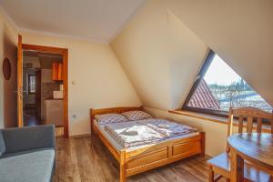 En eller flere senge i et værelse på Apartament II Chochołów 162c