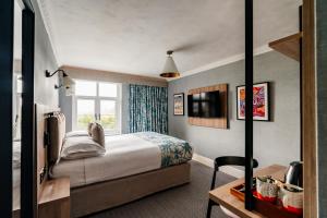 En eller flere senge i et værelse på Craig Manor