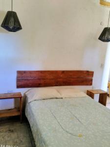 En eller flere senge i et værelse på Cabaña Los Algarrobos