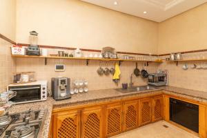 a kitchen with a sink and a counter top at Villa Korima in Marrakesh