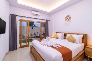 Giường trong phòng chung tại Kubu YN Bali